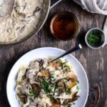 Creamy mushroom stroganoff in a white bowl.