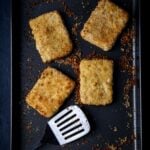 Crispy tofu cutlets on a baking sheet.