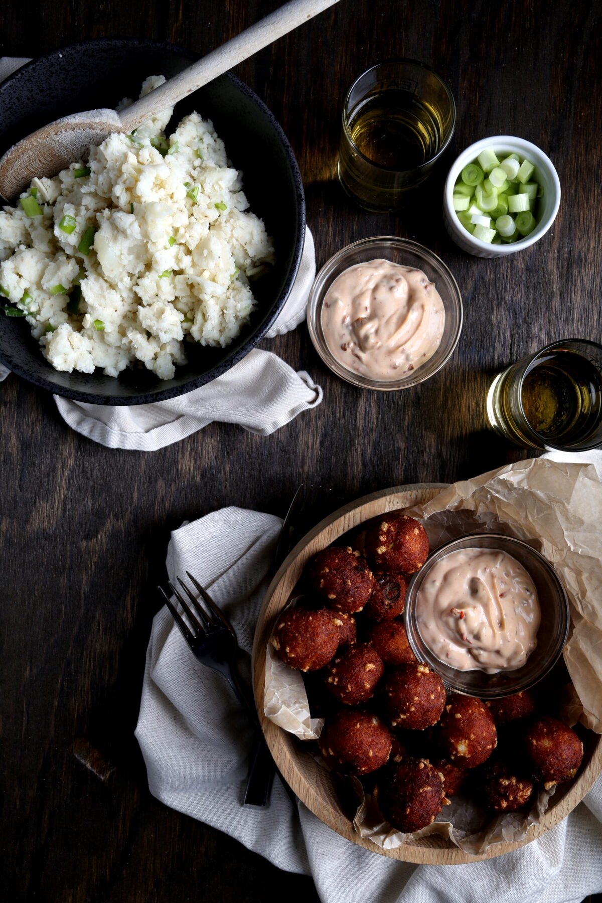 Loaded tater tots with creamy chipotle dipping sauce.