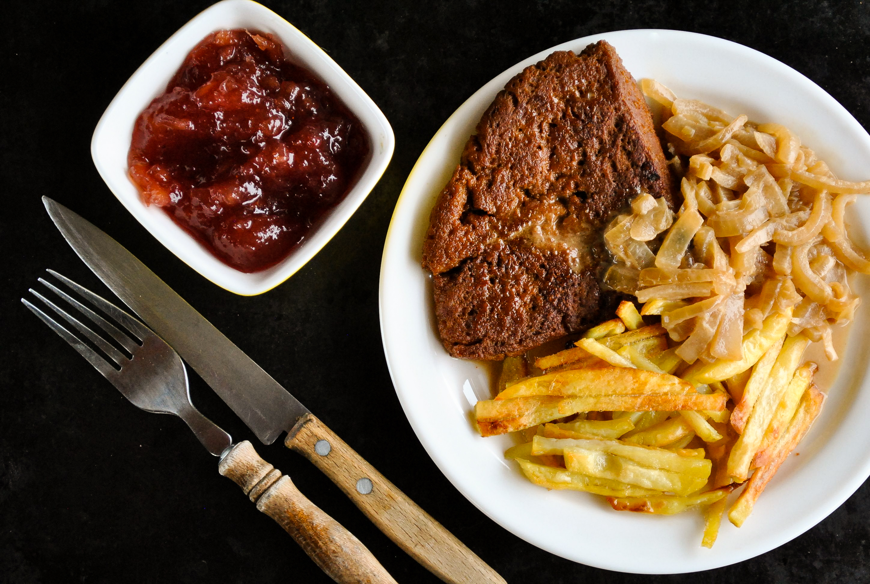 A homemade vegan seitan steak on a plate.