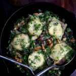 Homemade vegan ravioli in a cast-iron pan.
