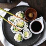 A close-up shot of a vegan California roll with vegan crab.