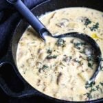 A creamy vegan clam chowder in a cast-iron pot—a cozy fall comfort food recipe.